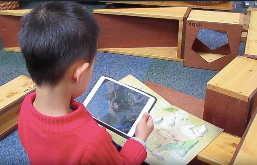 Child using a digital device. 
